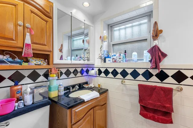 a kitchen that has a lot of cabinets and a stove