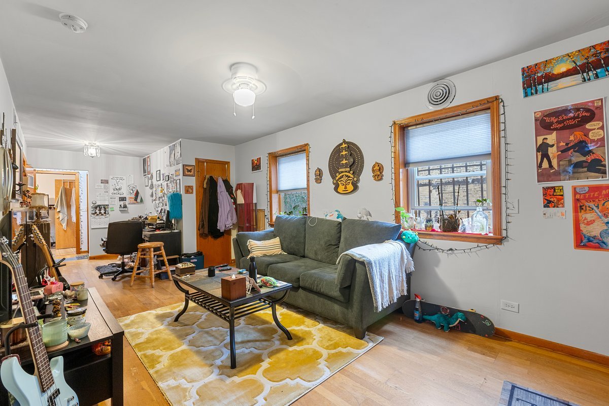 2708 West Division Street Chicago, IL 60622 - Photo 6 of 15 a living room with furniture a window and a flat screen tv