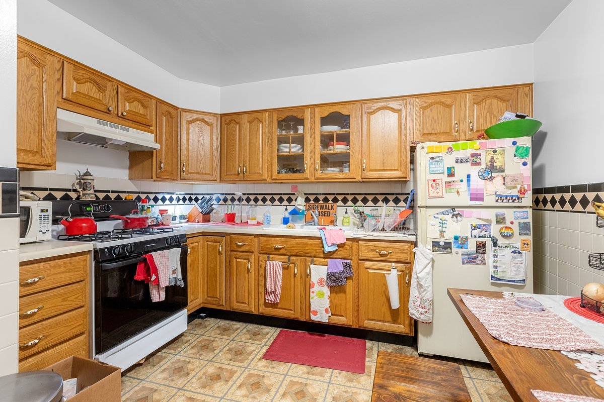 2708 West Division Street Chicago, IL 60622 - Photo 7 of 15 a open kitchen with stainless steel appliances granite countertop a stove and cabinets