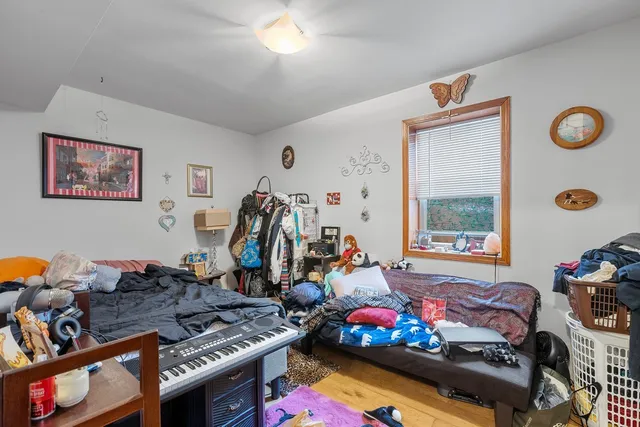 a bed room with furniture and a window