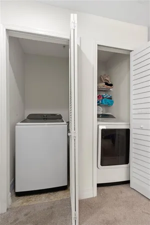 a bathroom with a granite countertop sink a toilet and a mirror