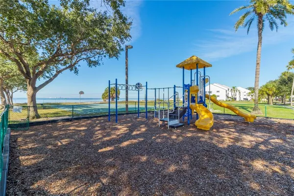 a bedroom with a bed and a television