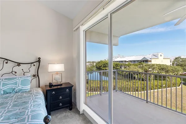 a view of a balcony with potted plants