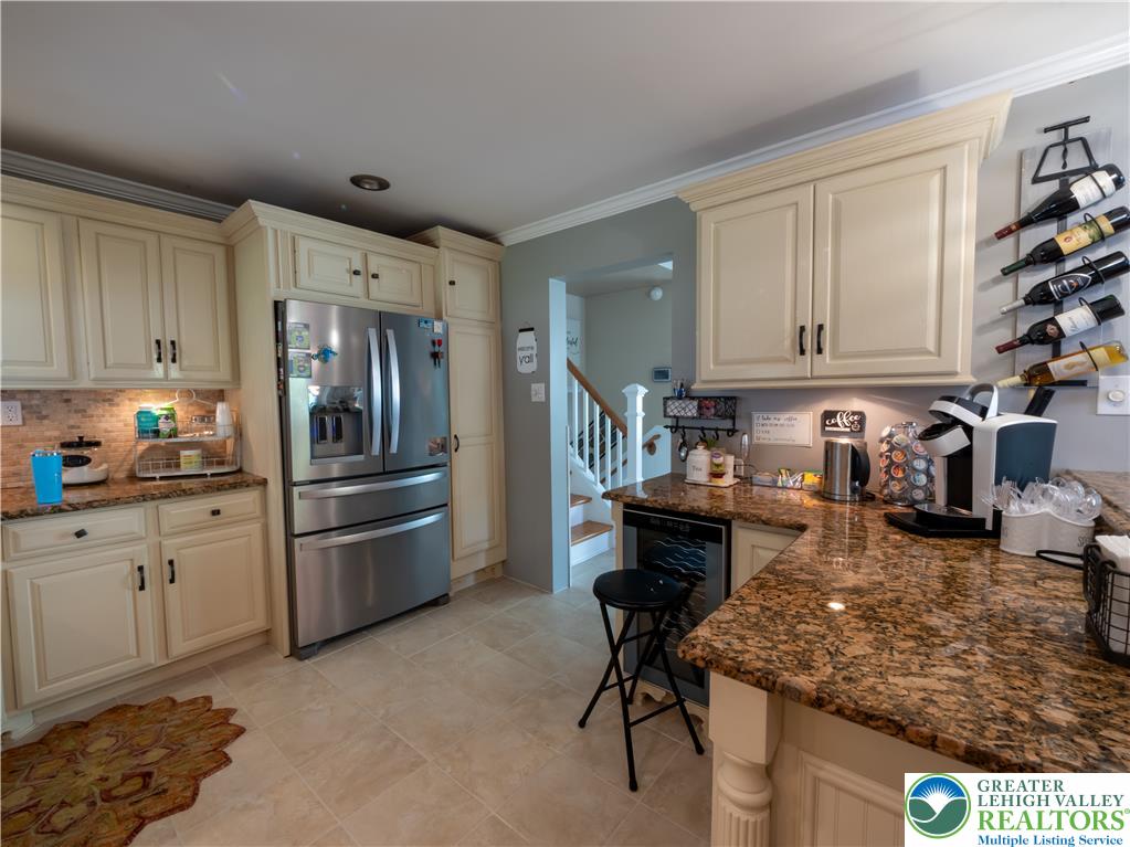 2087 Hopewell Road Bethlehem, PA 18017 - Photo 15 of 38 A well-appointed kitchen features rich granite countertops and integrated wine storage, perfect for entertaining.