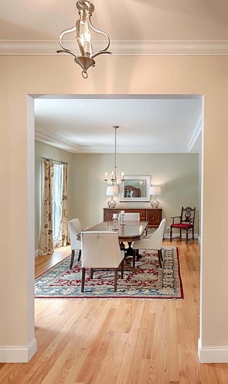 3 Ballard Terrace Lexington, MA 02420 - Photo 12 of 24 a dining room with a table or chairs and a wooden floor