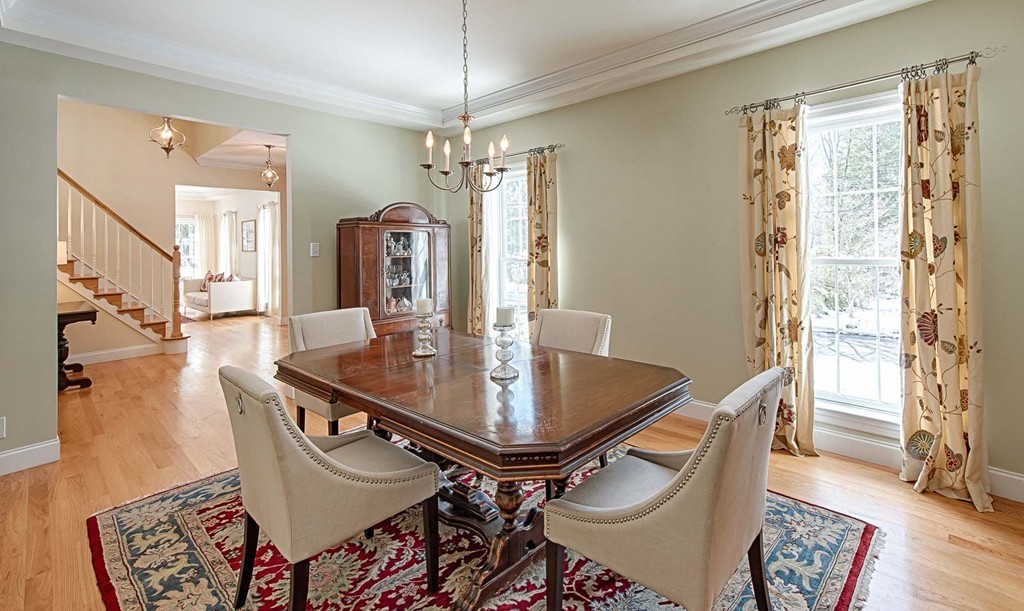3 Ballard Terrace Lexington, MA 02420 - Photo 13 of 24 a dining room with furniture a chandelier and wooden floor