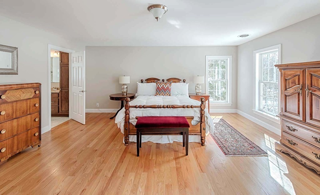 3 Ballard Terrace Lexington, MA 02420 - Photo 19 of 24 a bedroom with furniture and a wooden floor