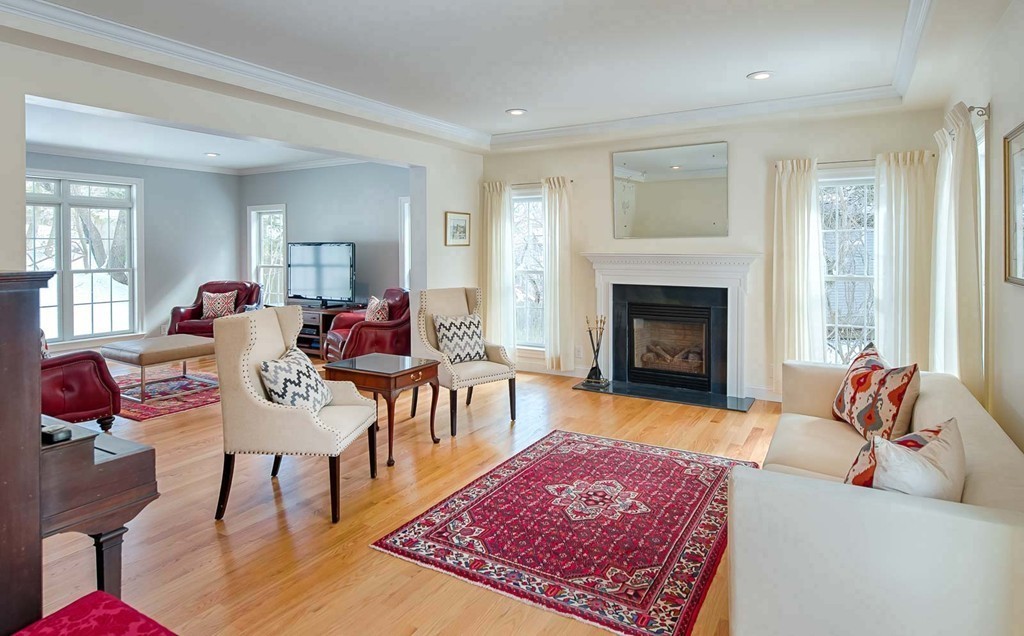 3 Ballard Terrace Lexington, MA 02420 - Photo 2 of 24 a living room with furniture and a fireplace