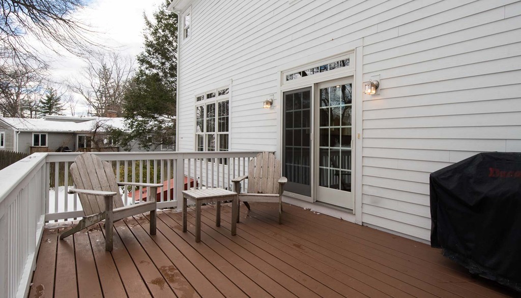 3 Ballard Terrace Lexington, MA 02420 - Photo 23 of 24 a view of deck with table and chairs and wooden floor