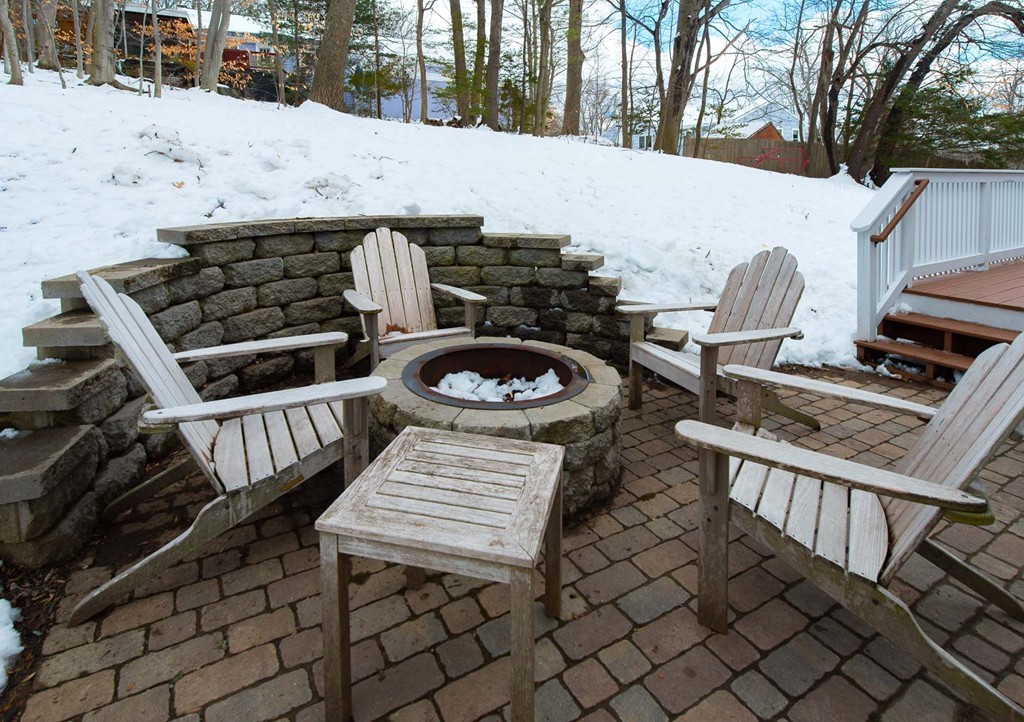 3 Ballard Terrace Lexington, MA 02420 - Photo 24 of 24 a table and chairs sitting in front of a house
