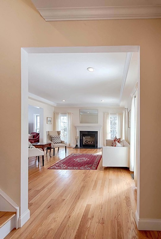 3 Ballard Terrace Lexington, MA 02420 - Photo 4 of 24 a living room with furniture and a fireplace