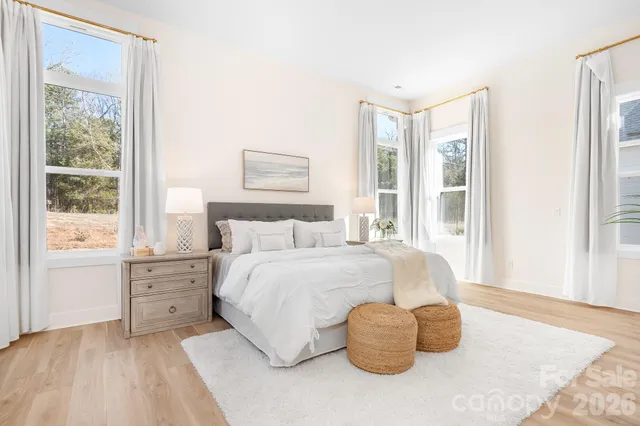a view of a living room and wooden floor