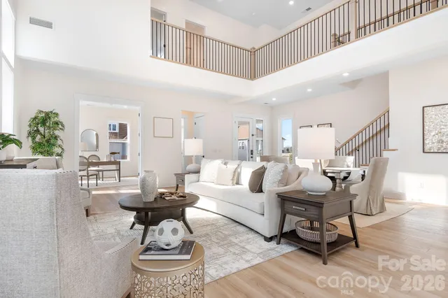 a kitchen with stainless steel appliances white cabinets and a stove top oven