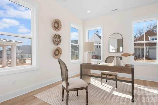 a kitchen with stainless steel appliances white cabinets and a sink