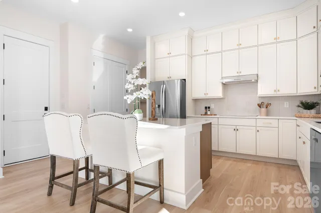 a bathroom with a double vanity sink and mirror