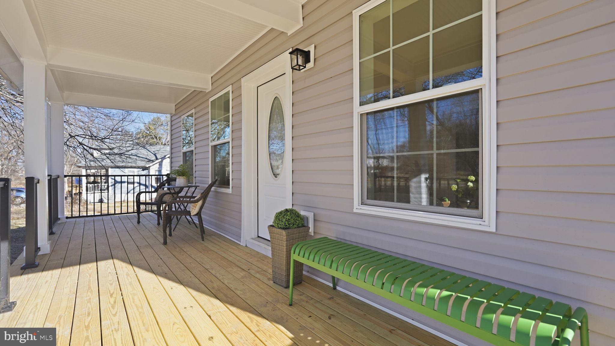 a view of balcony with a potted plant and wooden floor