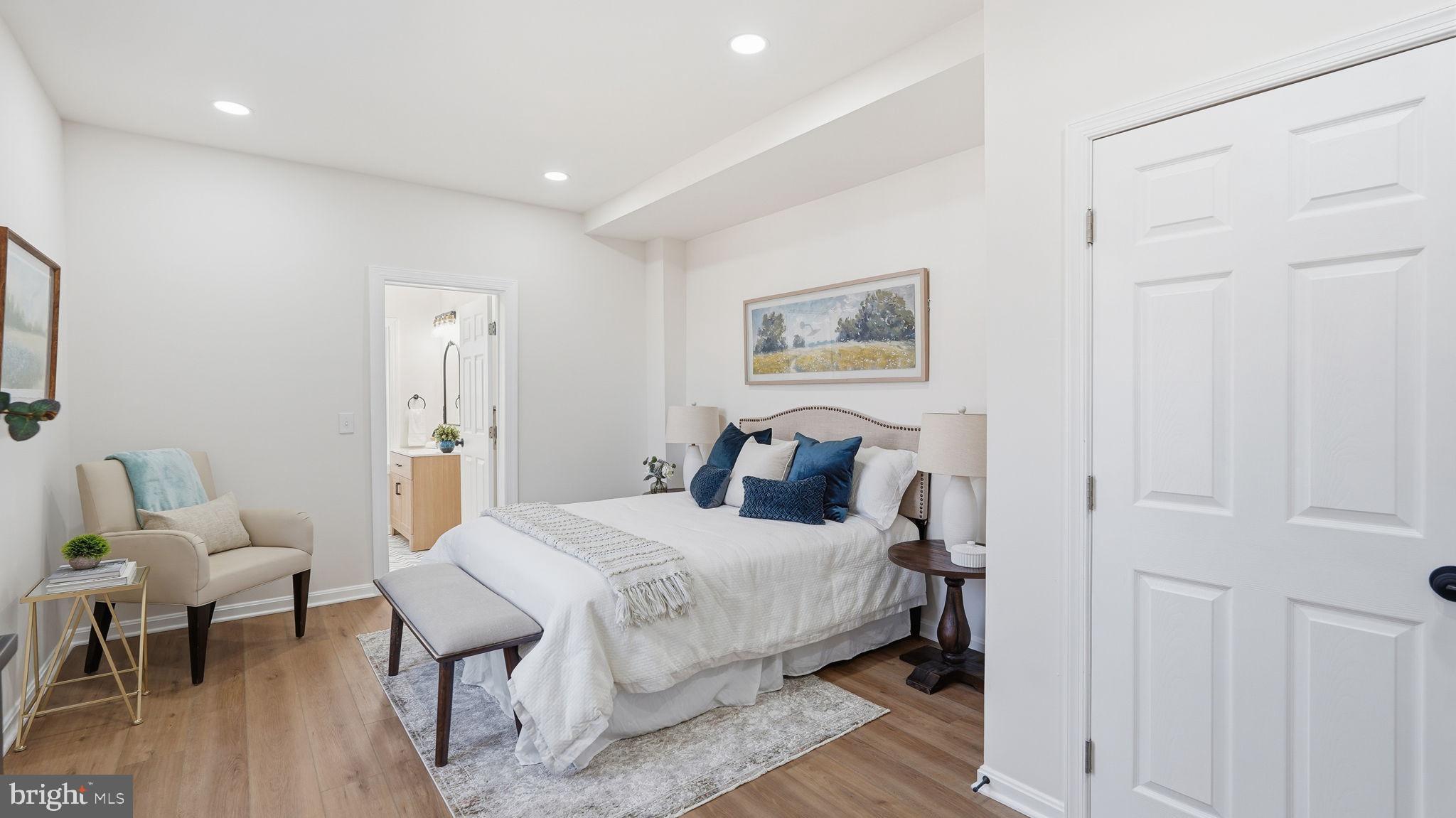 12219 River Road Remington, VA 22734 - Photo 13 of 31 a bedroom with a bed and a table