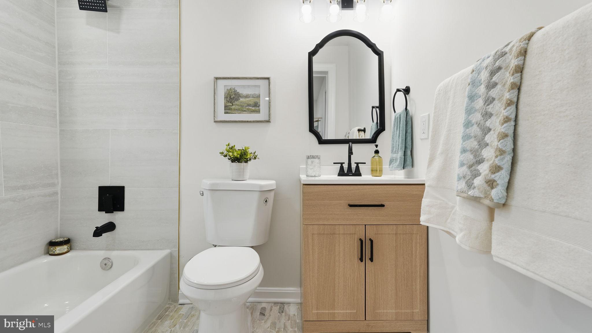 12219 River Road Remington, VA 22734 - Photo 16 of 31 a bathroom with a sink toilet and shower