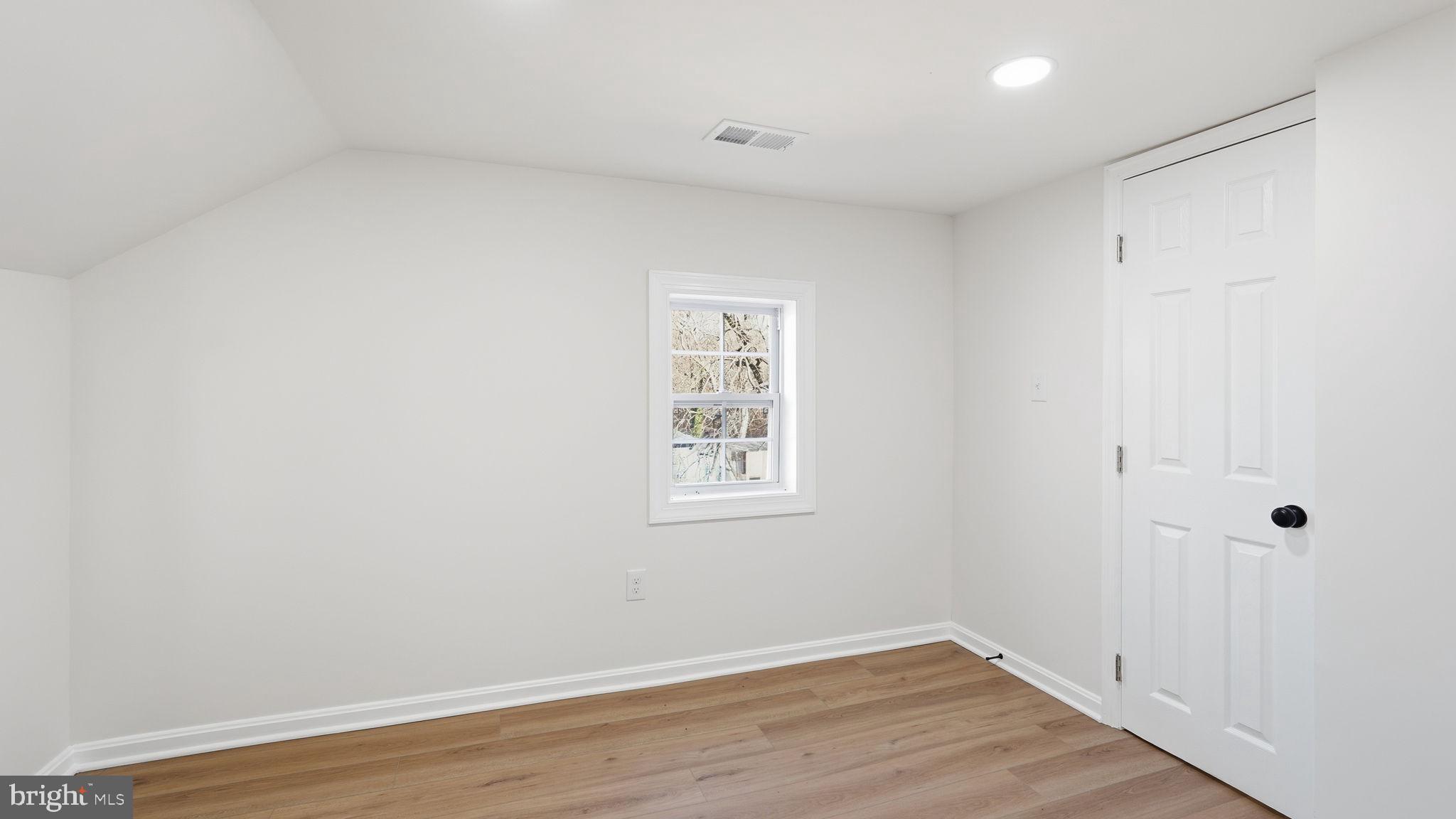 12219 River Road Remington, VA 22734 - Photo 23 of 31 an empty room with wooden floor and window