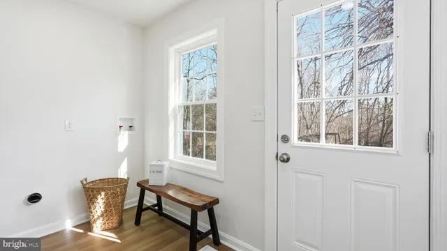 a view of a livingroom with furniture and windows