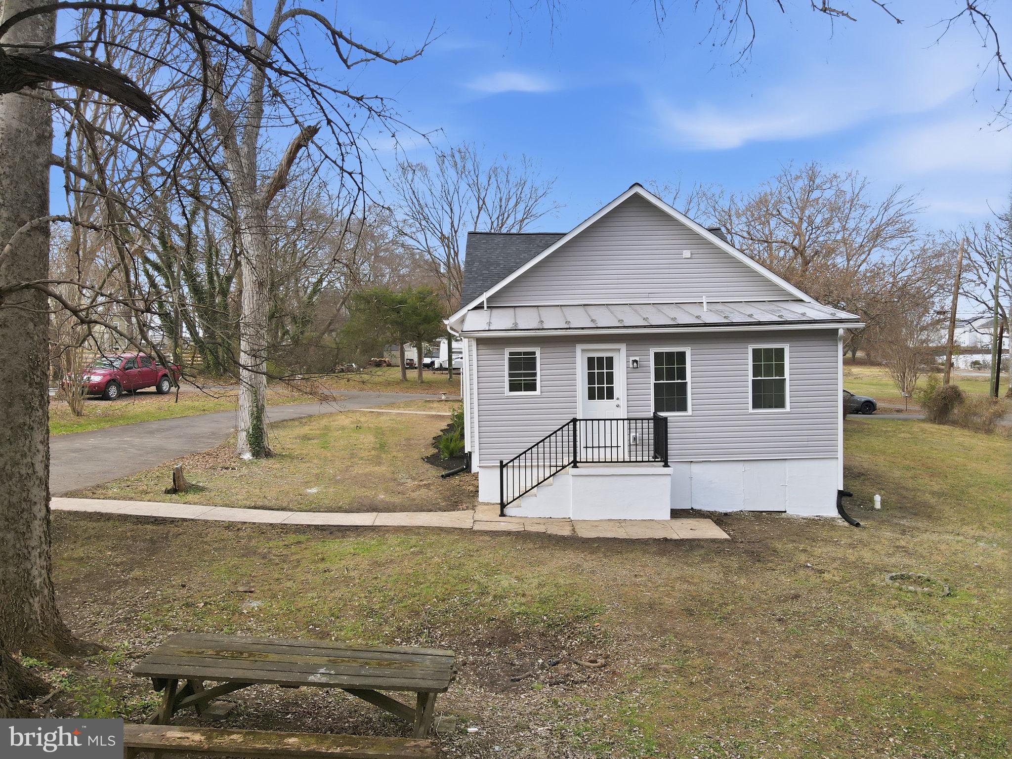 12219 River Road Remington, VA 22734 - Photo 29 of 31 a view of a house with backyard and trees