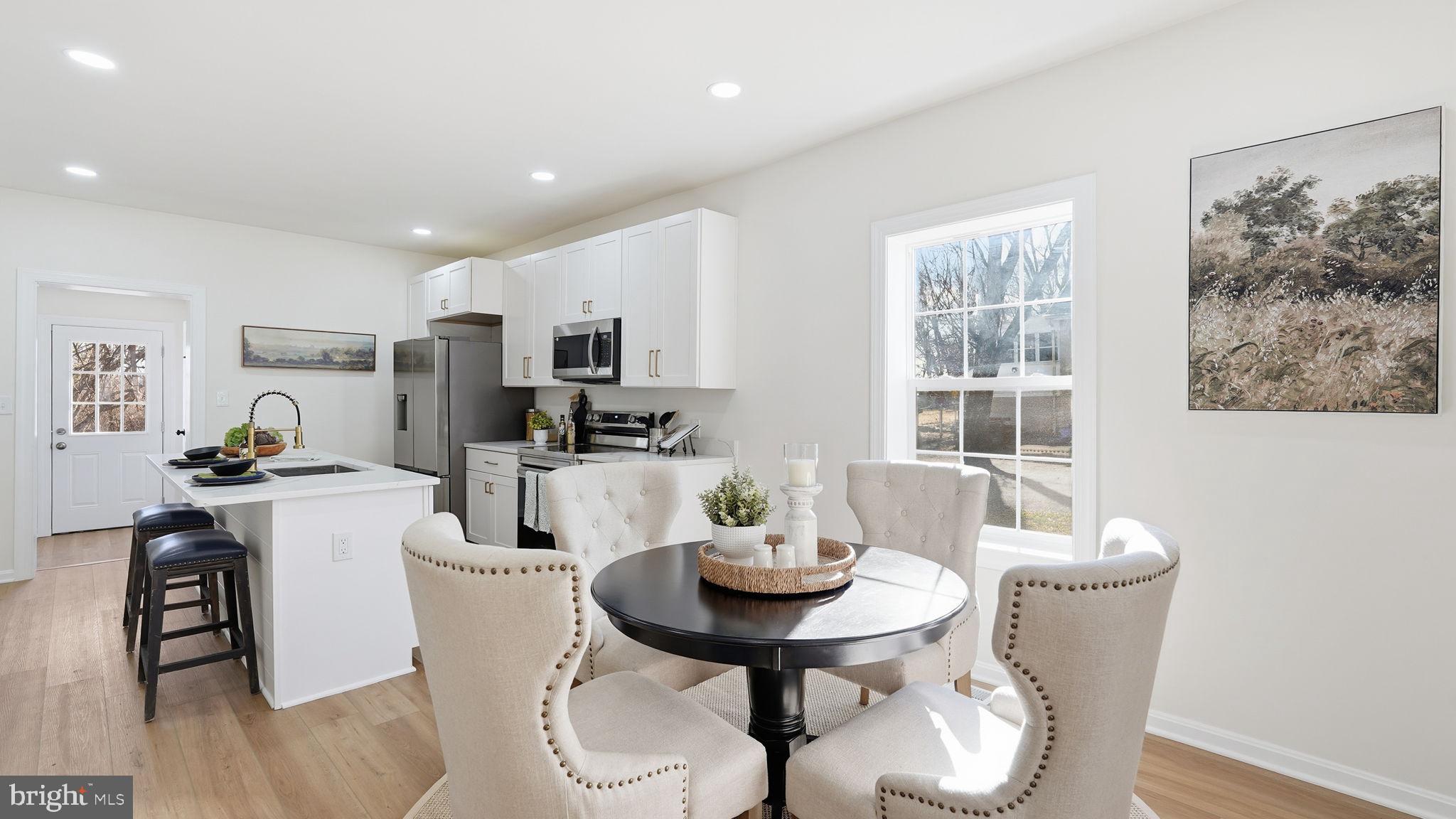 12219 River Road Remington, VA 22734 - Photo 6 of 31 a view of a dining room with furniture and wooden floor