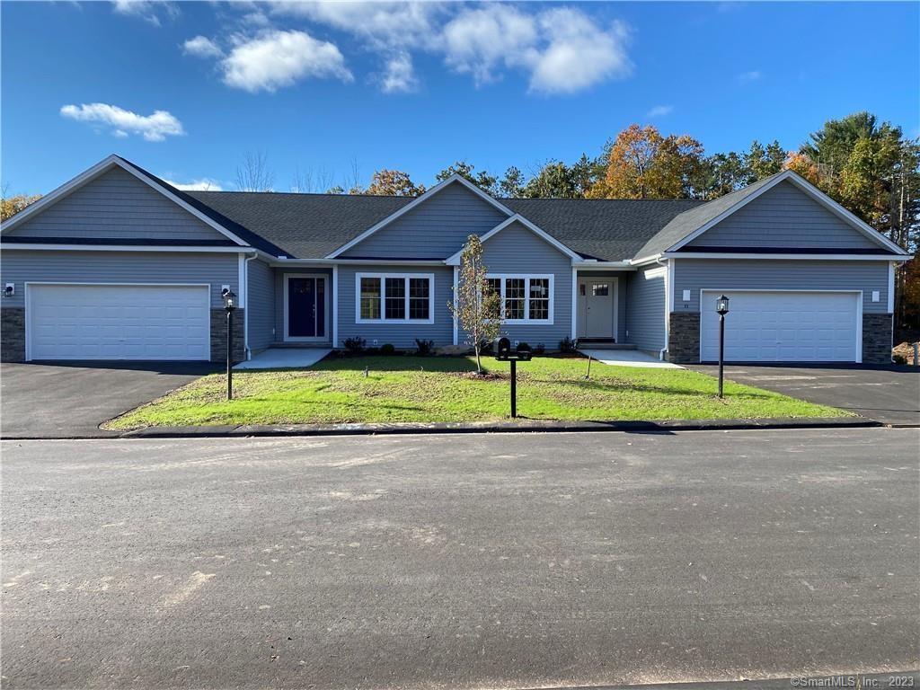 34 Eleanor Road, Unit 34 Somers, CT 06071 - Photo 1 of 1 a view of a house with a yard and large trees