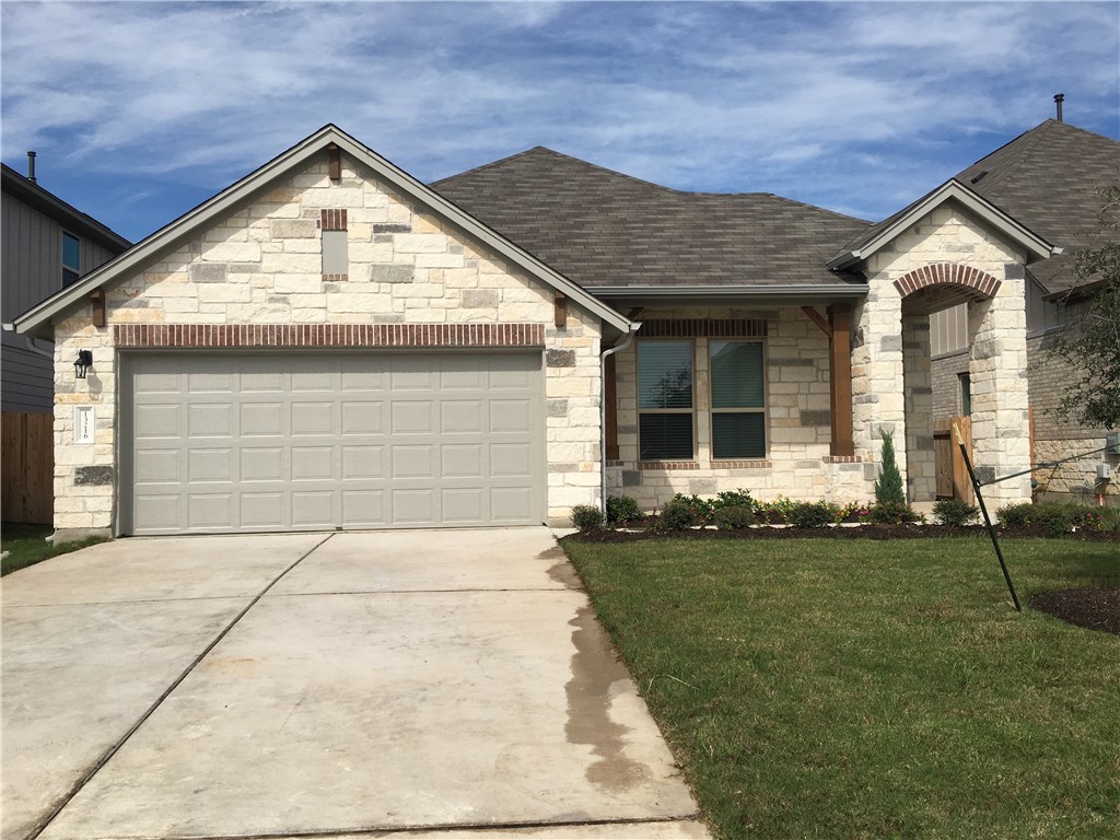 13216 Mariscan Street Manchaca, TX 78652 - Photo 1 of 1 a view of outdoor space yard and front view of a house