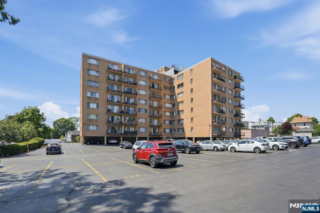 265 Main Street, Unit 704 Ridgefield Park, NJ 07660 - Photo 22 of 23 a car parked in front of a building