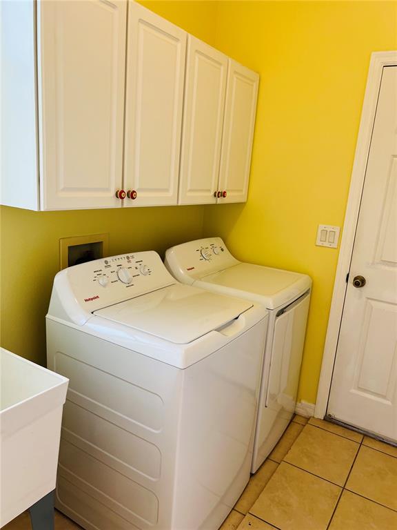 5446 Sea Leopard Street Tavares, FL 32778 - Photo 18 of 39 a utility room with dryer and washer