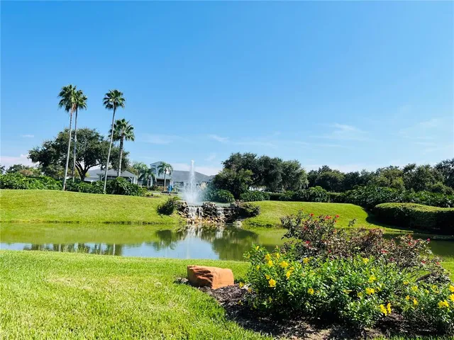 a view of a golf course with a lake view