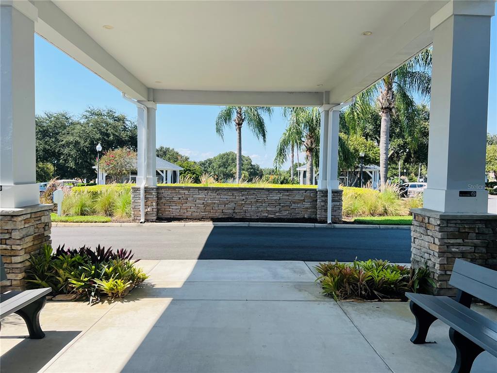 5446 Sea Leopard Street Tavares, FL 32778 - Photo 22 of 39 a view of front door and outdoor seating