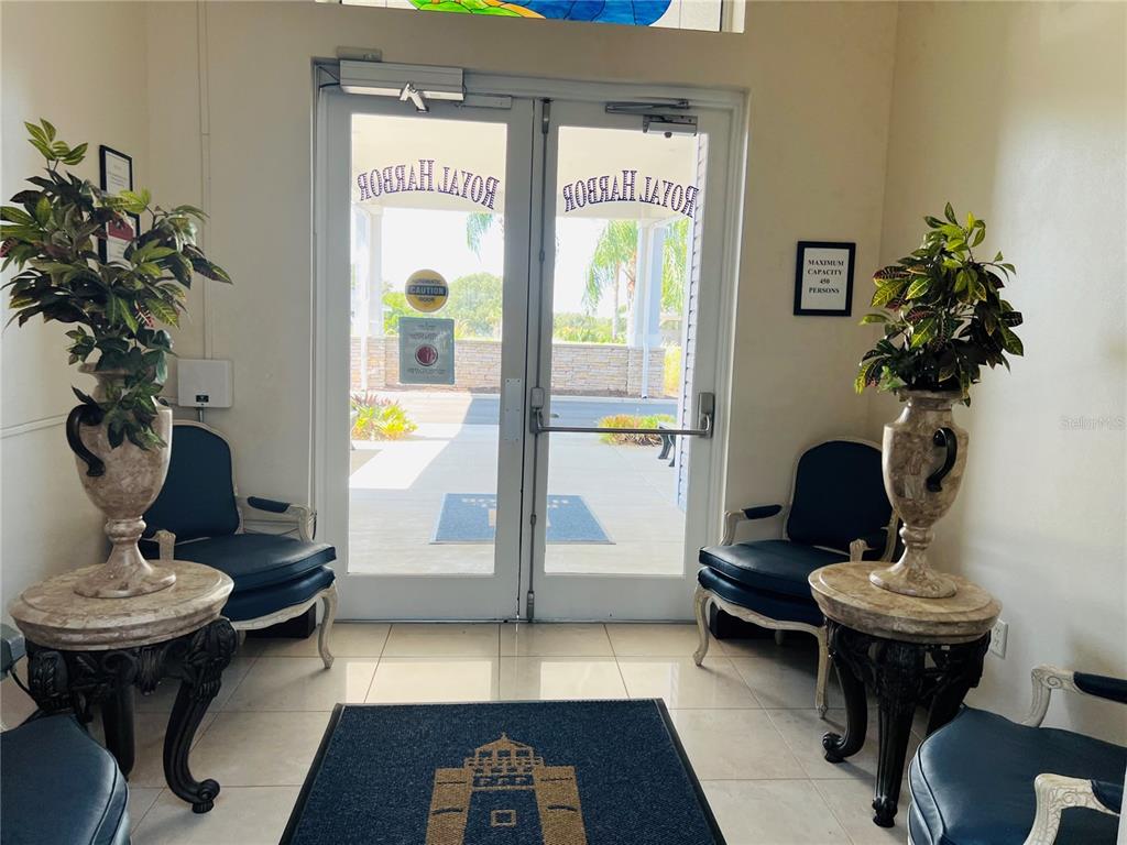 5446 Sea Leopard Street Tavares, FL 32778 - Photo 23 of 39 a living room with furniture and a potted plant
