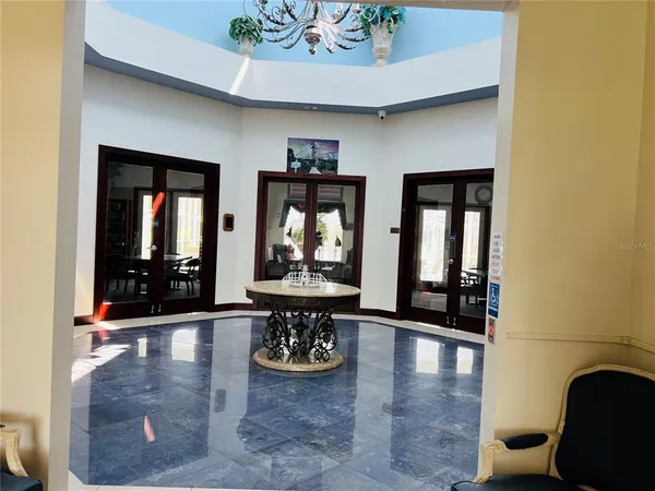 a view of an entryway and livingroom with furniture