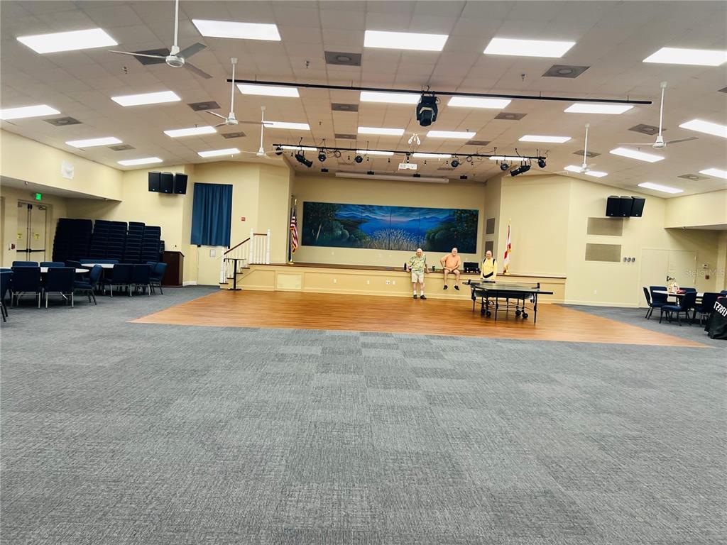 5446 Sea Leopard Street Tavares, FL 32778 - Photo 26 of 39 a living room with furniture and a flat screen tv