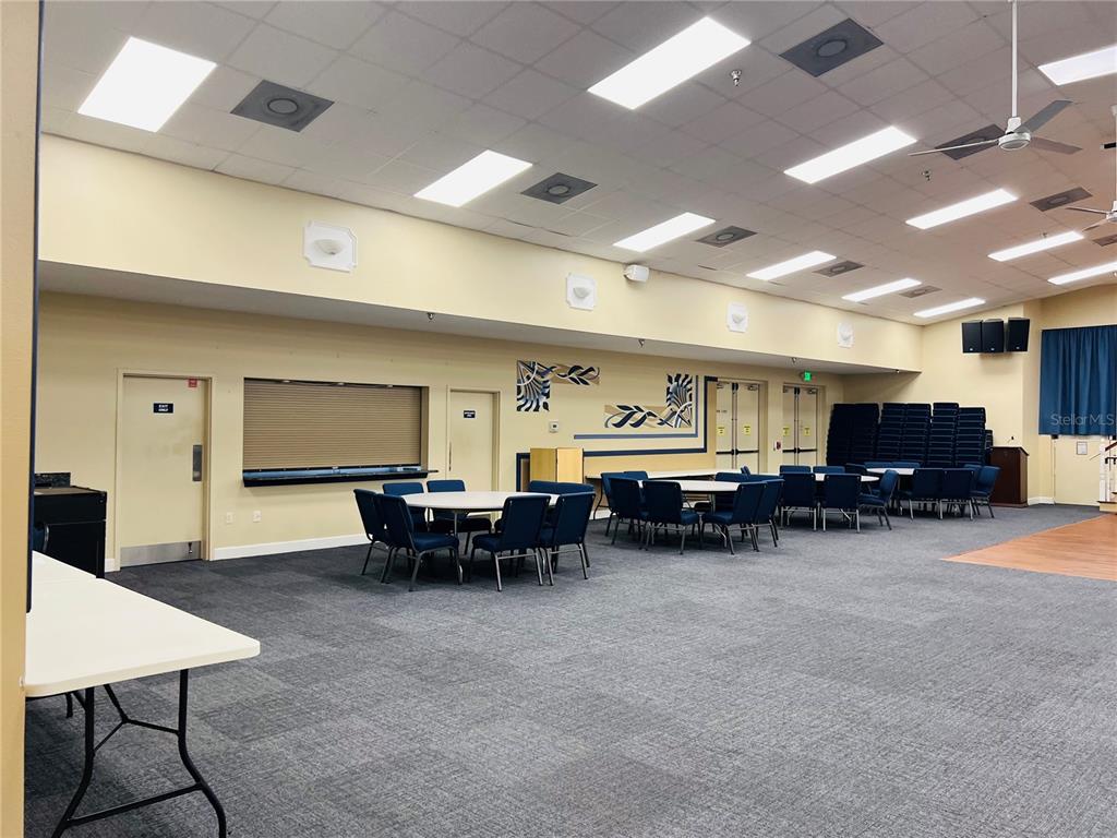 5446 Sea Leopard Street Tavares, FL 32778 - Photo 28 of 39 a living room with furniture and a flat screen tv