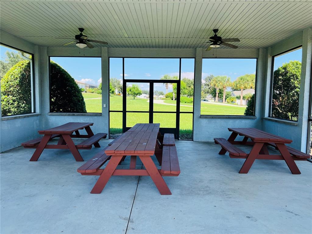 5446 Sea Leopard Street Tavares, FL 32778 - Photo 39 of 39 a reading room with furniture and a large window