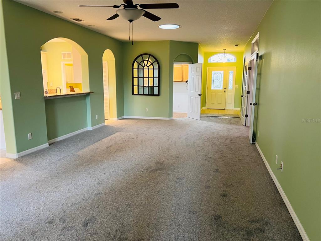 5446 Sea Leopard Street Tavares, FL 32778 - Photo 5 of 39 a view of an empty room with a window