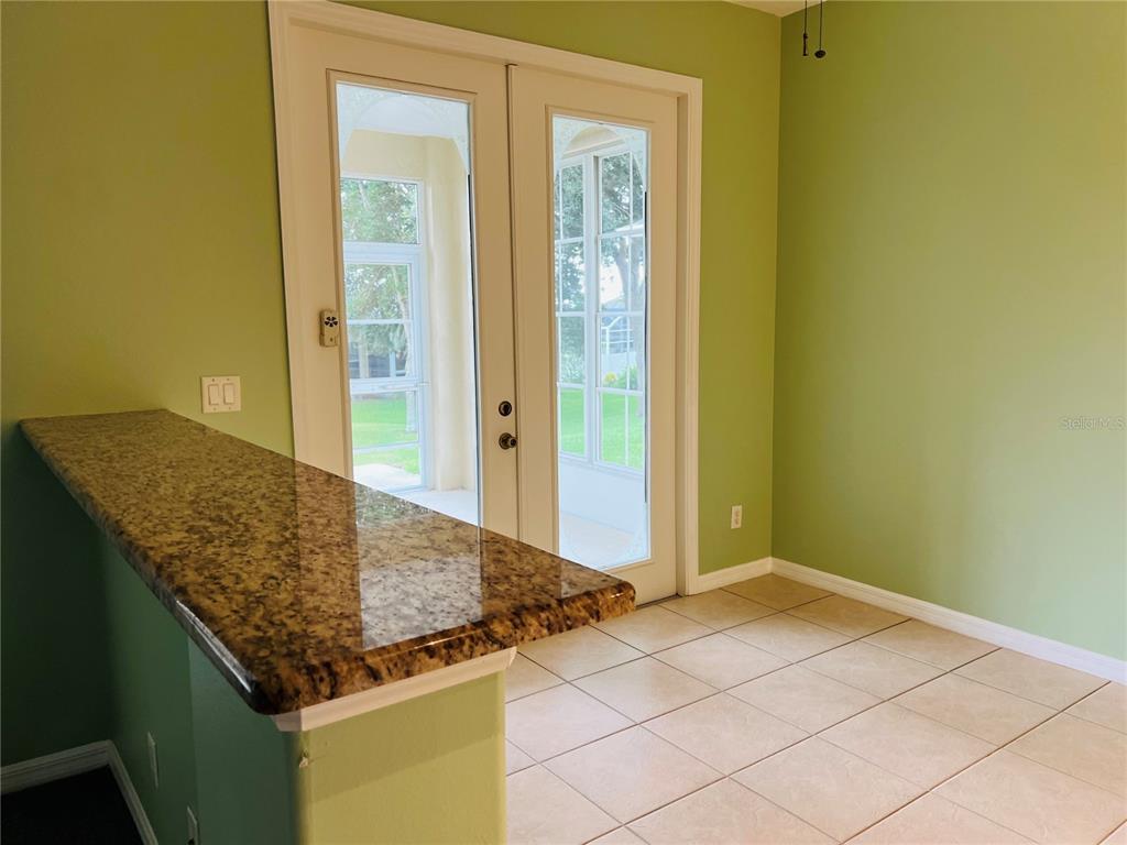 5446 Sea Leopard Street Tavares, FL 32778 - Photo 10 of 39 a kitchen with a sink