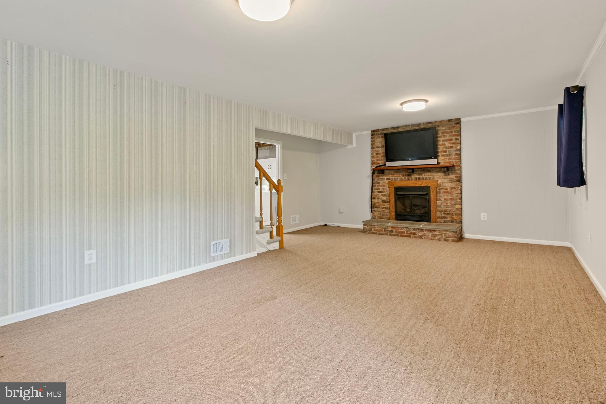 2209 Coffeewood Court Silver Spring, MD 20906 - Photo 22 of 40 Lower level with gas Fireplace and built-in TV