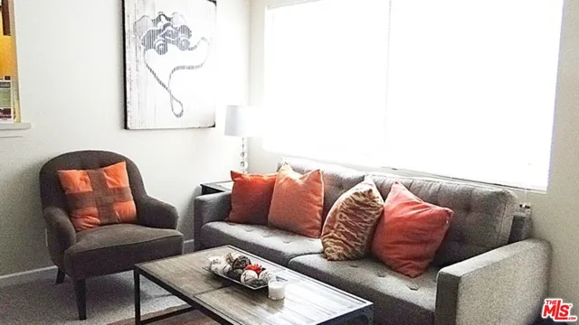 a view of living room with furniture and flat screen tv