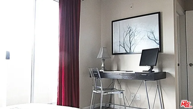 a living room with a table and chairs