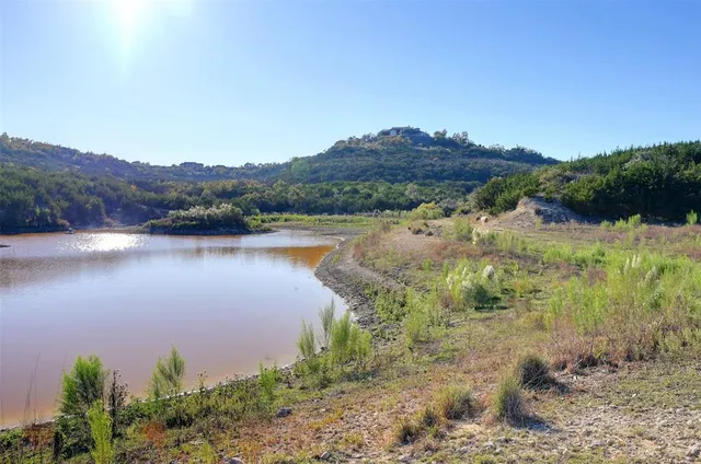 a view of a swimming pool with an ocean view