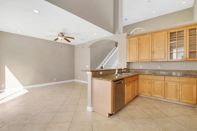 a kitchen with stainless steel appliances granite countertop a stove and a sink