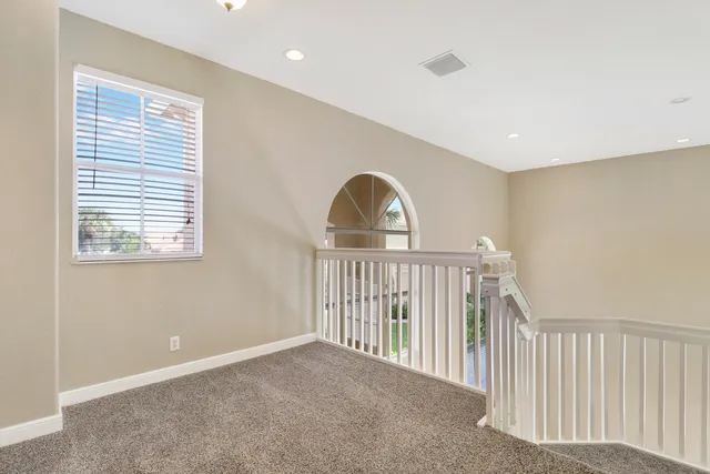 a view of a hallway with windows