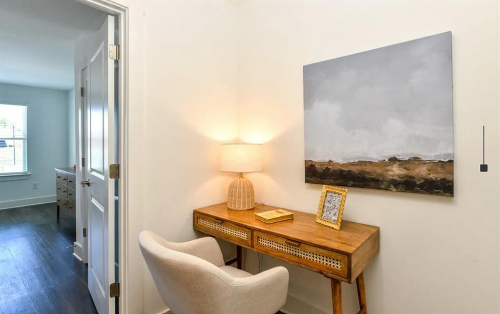 5055 Southwood Road, Unit 2103 Union City, GA 30213 - Photo 11 of 24 a view of a workspace with furniture and wooden floor