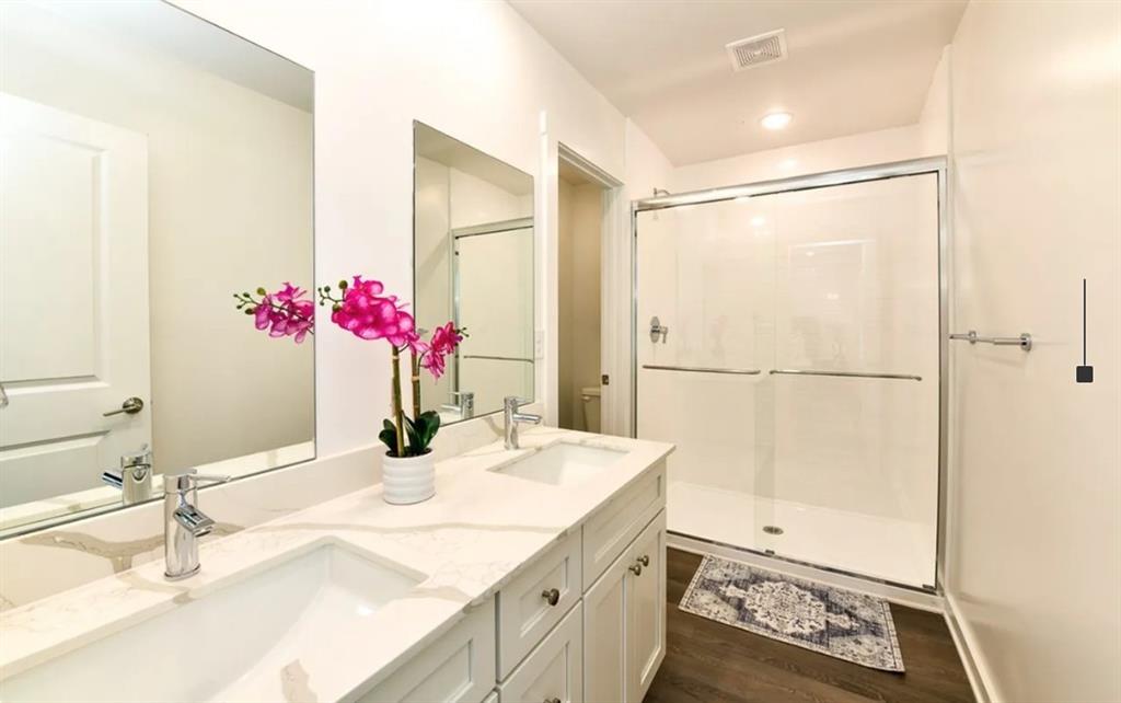 5055 Southwood Road, Unit 2103 Union City, GA 30213 - Photo 13 of 24 a bathroom with a granite countertop shower sink vanity and mirror