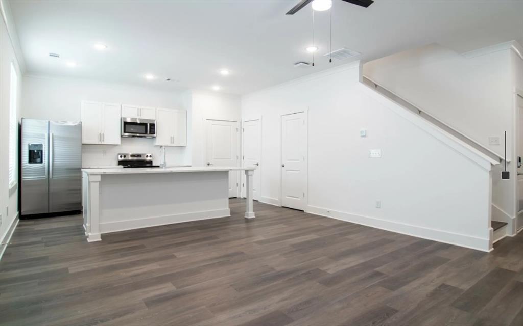 5055 Southwood Road, Unit 2103 Union City, GA 30213 - Photo 2 of 24 a kitchen with stainless steel appliances a refrigerator and a stove top oven