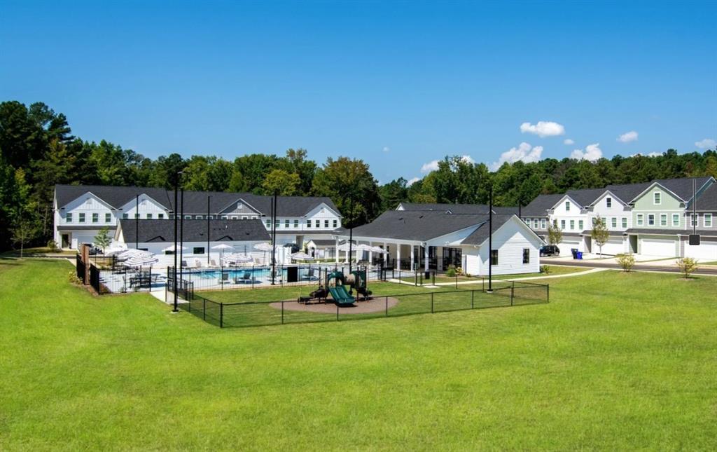 5055 Southwood Road, Unit 2103 Union City, GA 30213 - Photo 23 of 24 a view of a house with swimming pool and sitting area