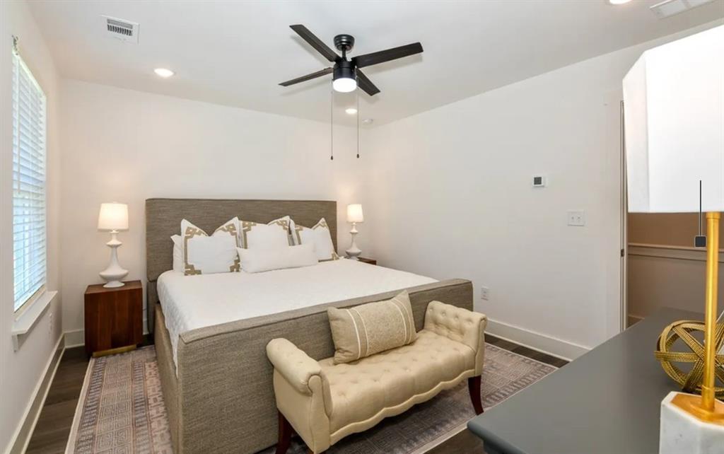 5055 Southwood Road, Unit 2103 Union City, GA 30213 - Photo 10 of 24 a bedroom with a bed and a couch